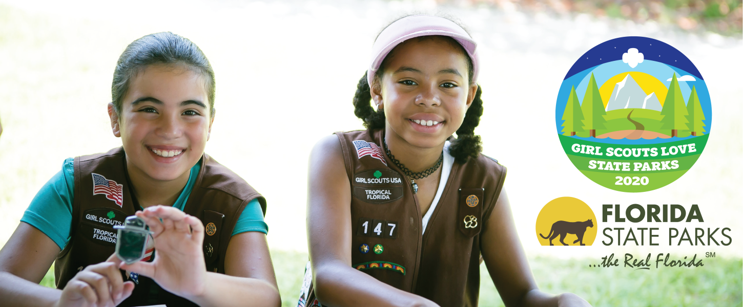 Two Girl Scouts doing Junior Ranger activities.  Includes superimposed Girl Scouts Love State Parks and Florida State Park logos