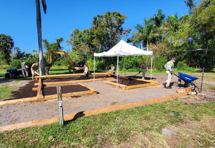 group of people working to build a garden