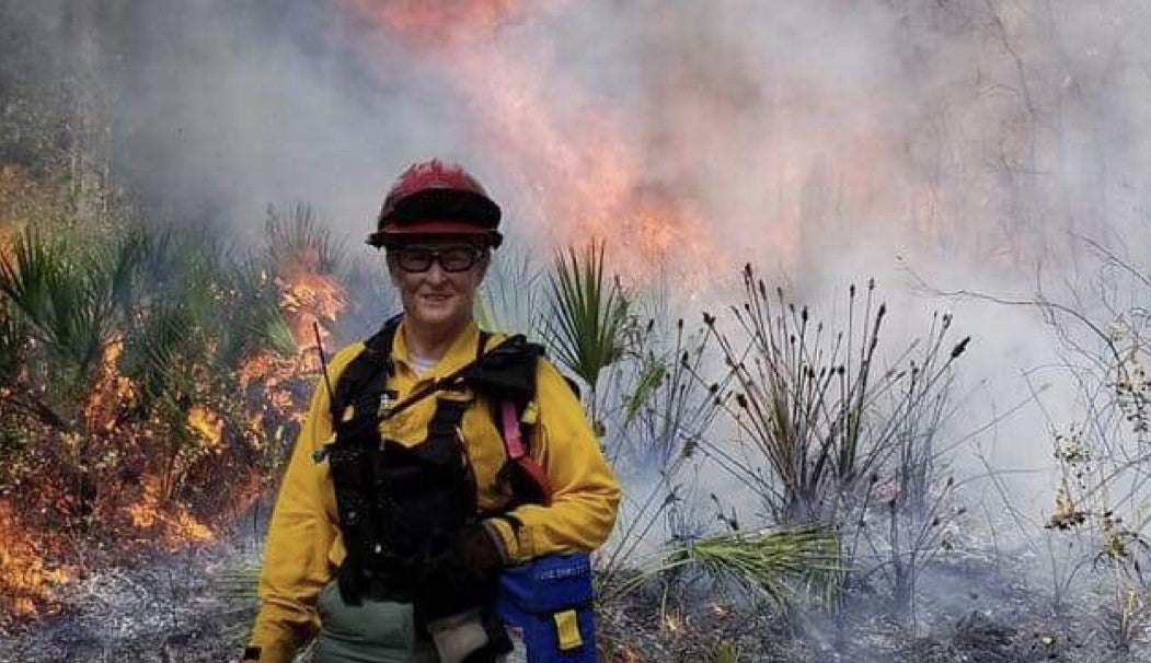 Elaine Fisher works on a prescribed fire.