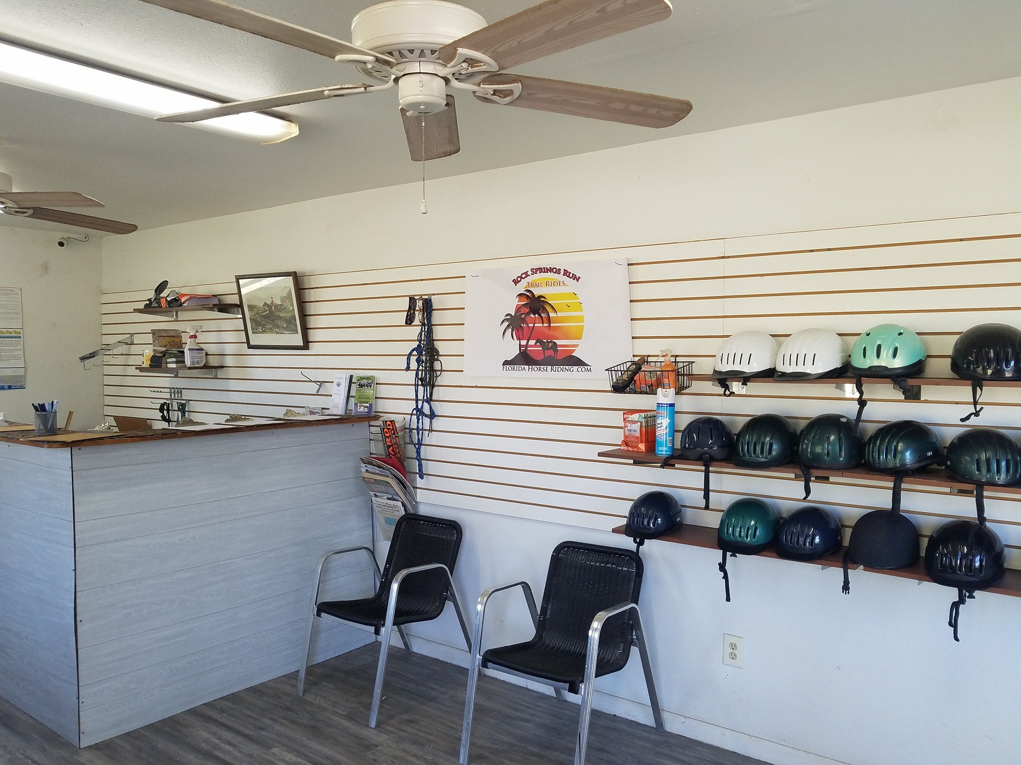 Office of Rock Springs Run Trail Rides with helmets on the wall