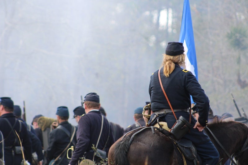 the backs of reenactors in union dress