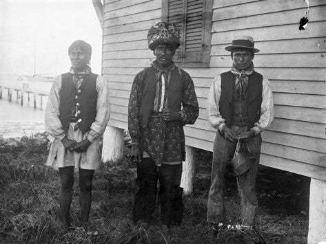 Barnacle Seminoles wear a mix of traditional Seminole garb and western dress at the Barnacle boathouse