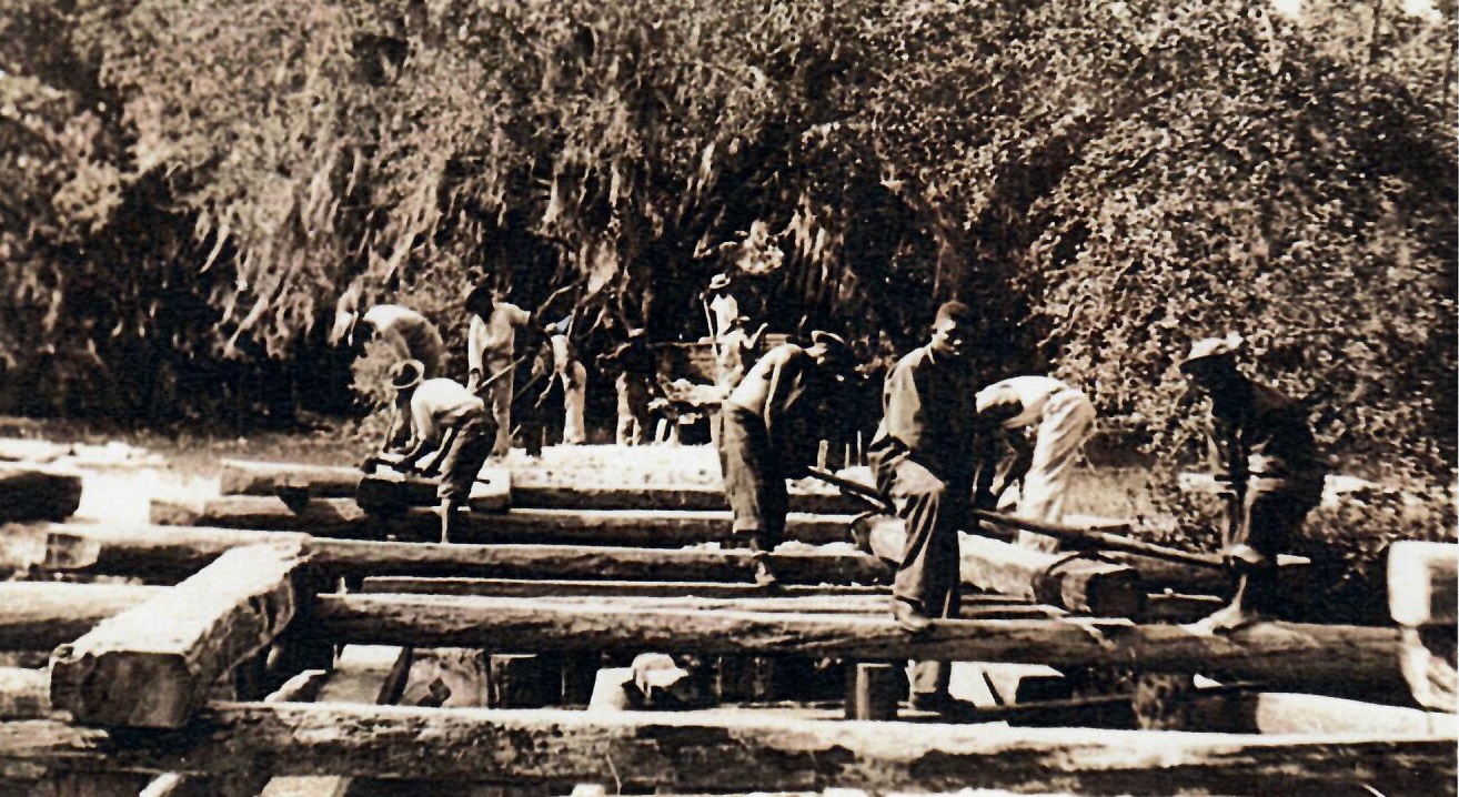 Men of the CCC build the main park bridge from wood