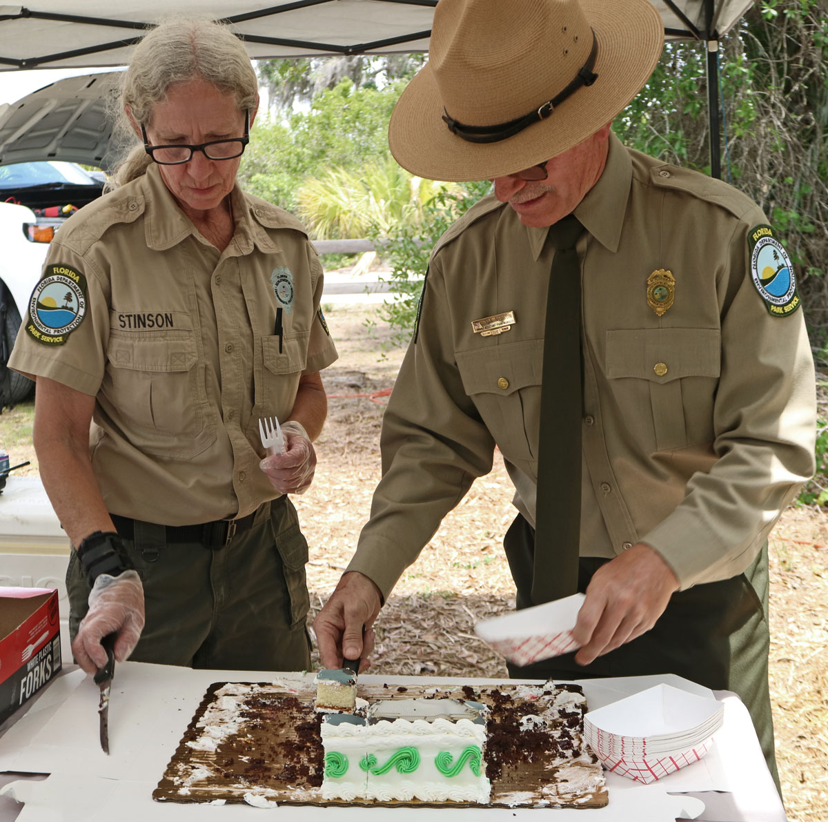 Diana Stinson assists with serving cake at a special event at the park.