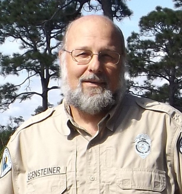 Erik Egensteiner, biologist at Lake Kissimmee and Allen David Broussard Catfish Creek Preserve state parks.