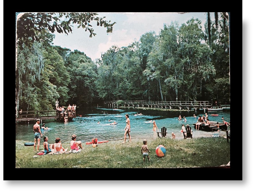 Gilchrist blue springs, people swimming and on shore. Photo from 1960s. 