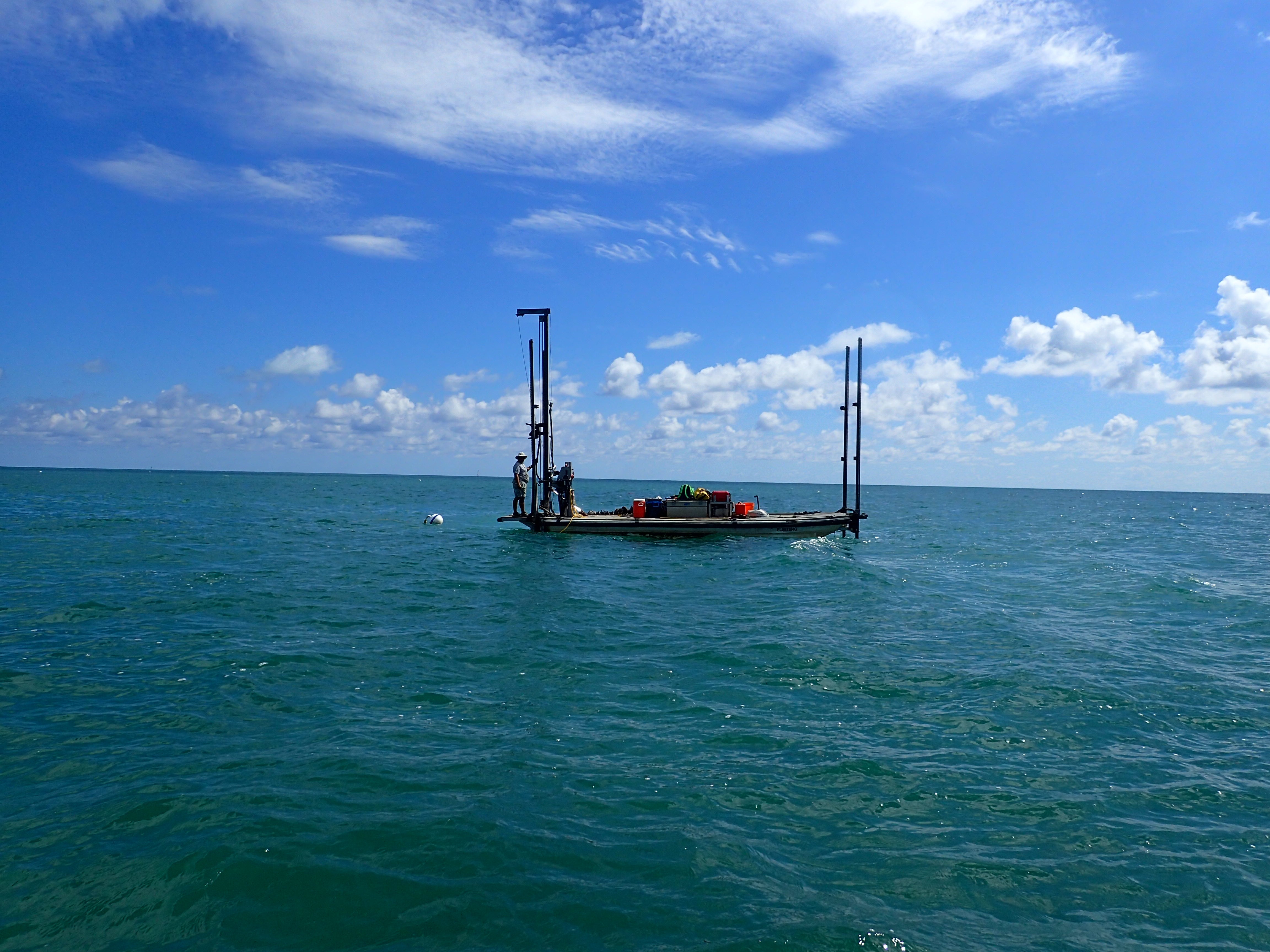 A contractor reinstalling mooring buoys behind Lignumvitae Key.