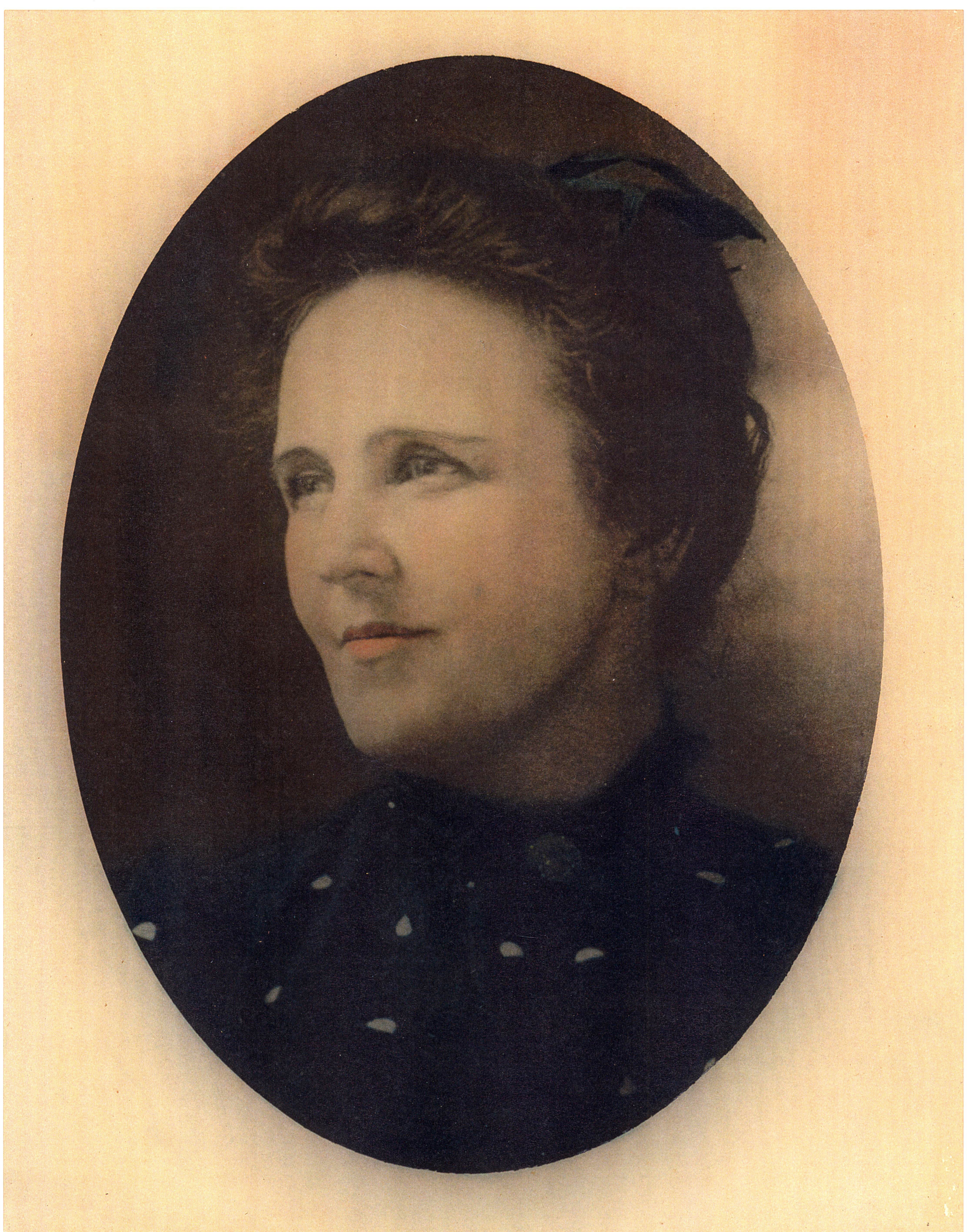 Portrait of Miss Lucie Richards with her hair pulled back.