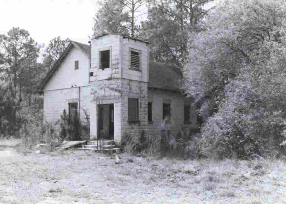 A black and white picture of a church building. 