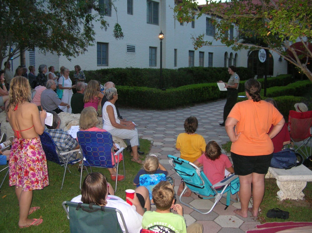 Biologist Patricia Wilbur leads the group in reciting a poem about Chimney Swifts.