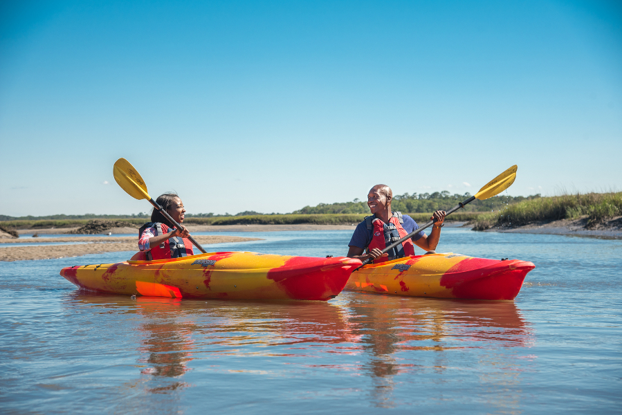 Two kayakers paddle along Simpson's Creek in Talbot Island State Park.