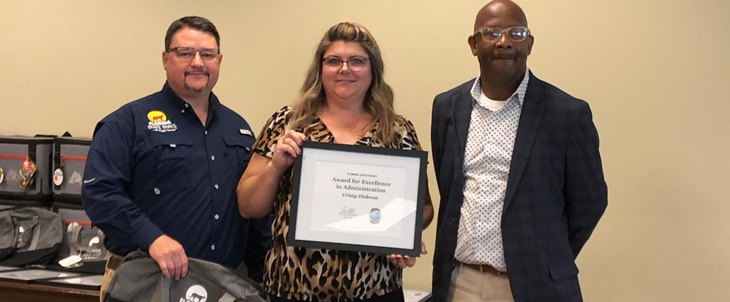 Brian Fugate and BJ Givens present the award to Cristy Disbrow.