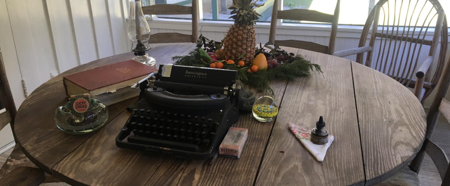 A typewriter sits on a table at the homestead.