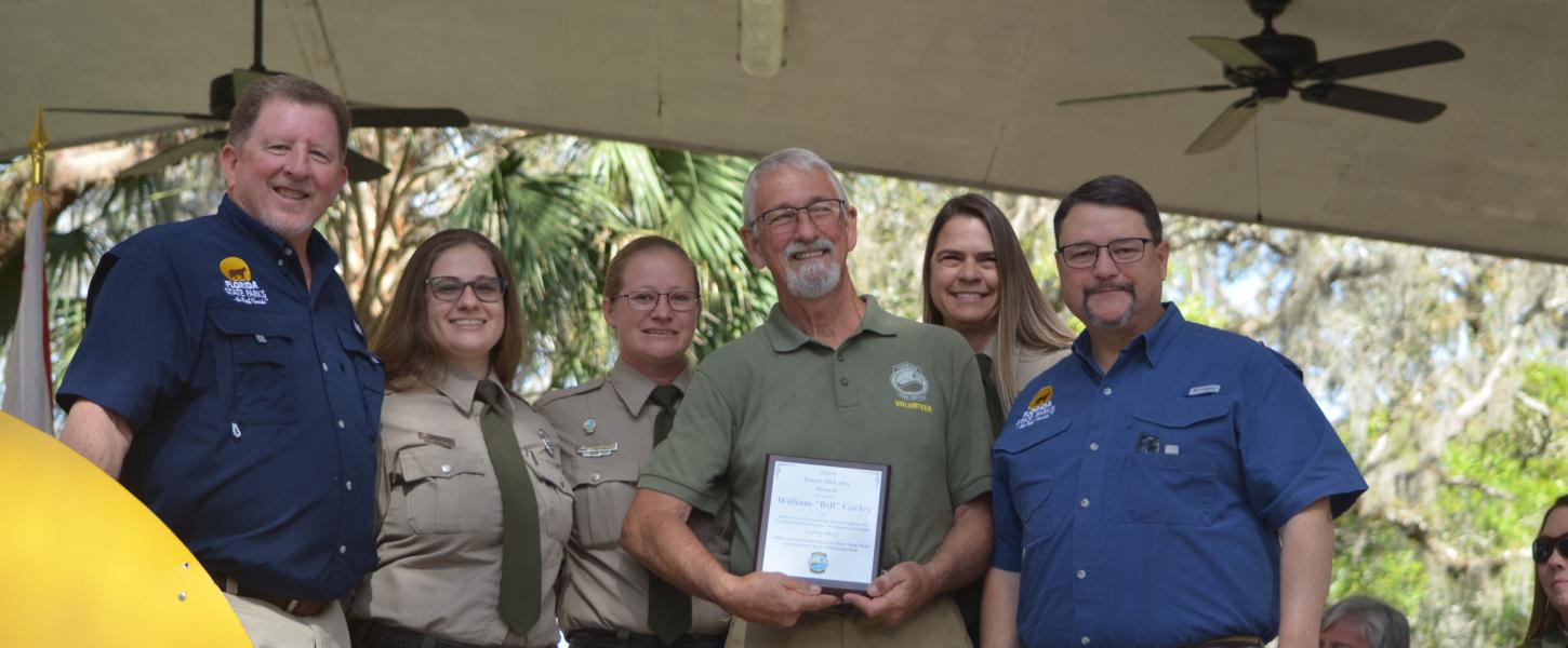 Volunteer receiving award.