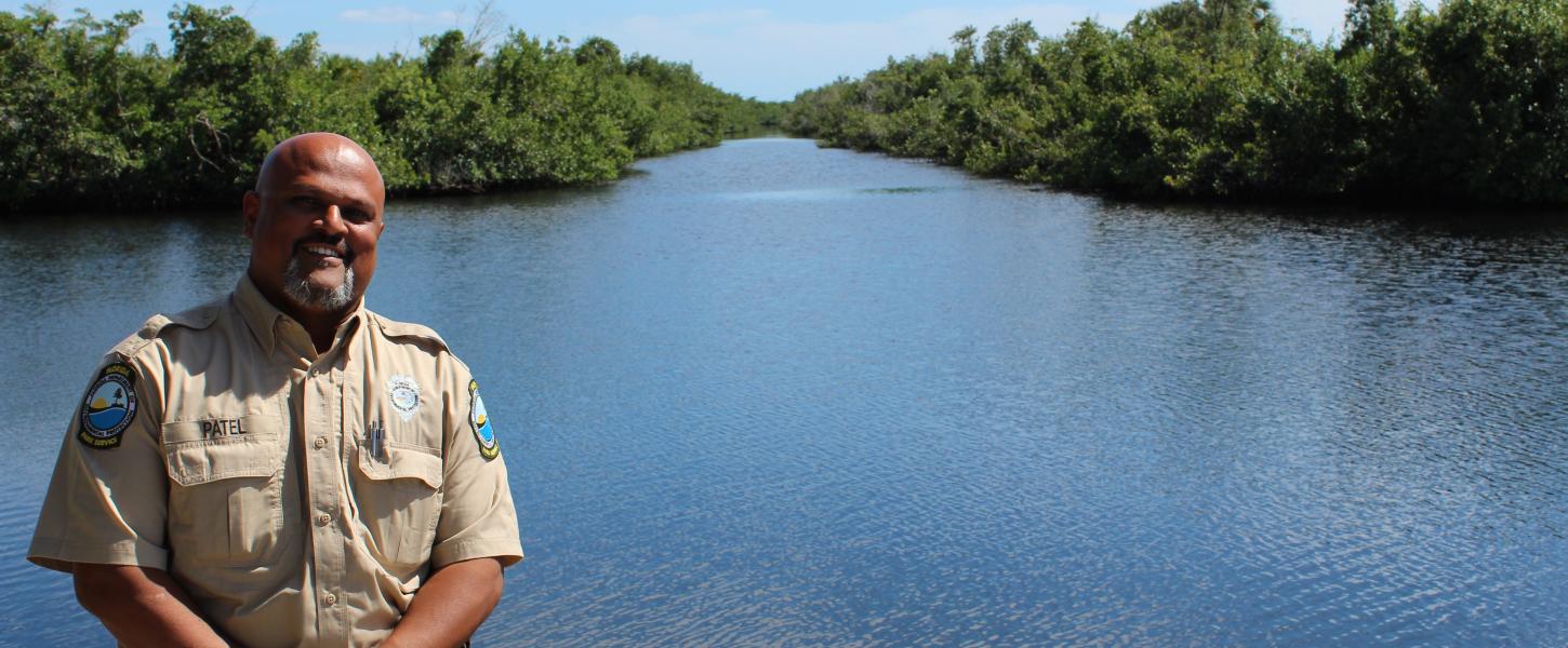 Maulik Patel stands on the seawall at Collier-Seminole State Park.