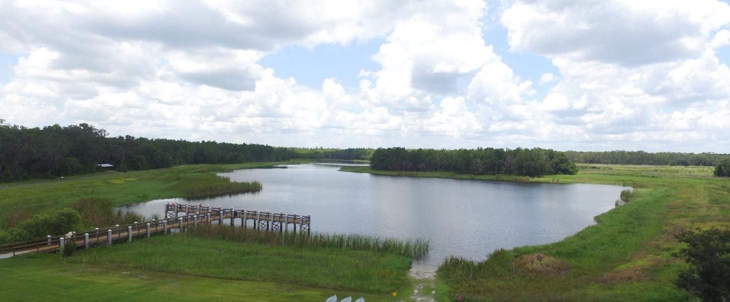 aerial photo of mac lake, the dock, and kayak/canoe rentals