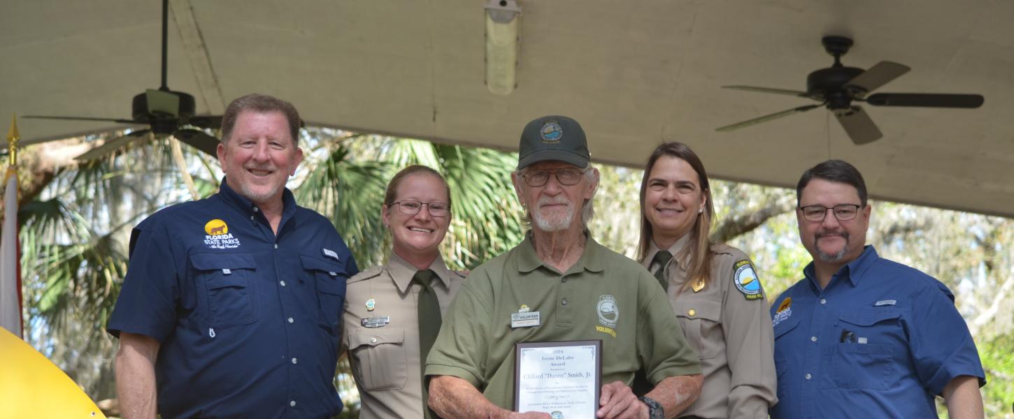 Volunteer receiving award.