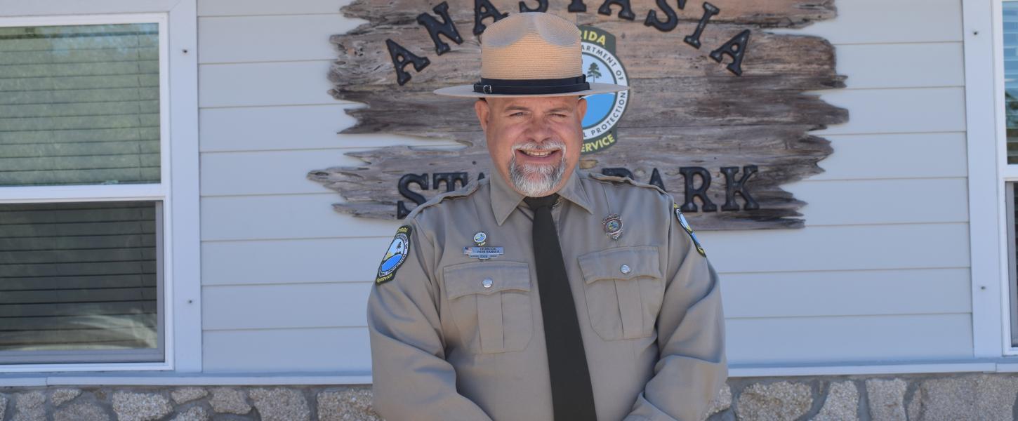 Dean Cox standing in front of a building.