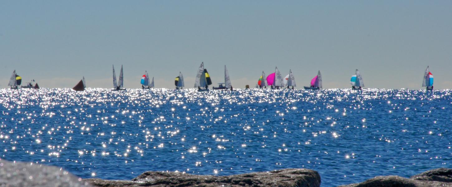 A view of a line of boats in the distance.