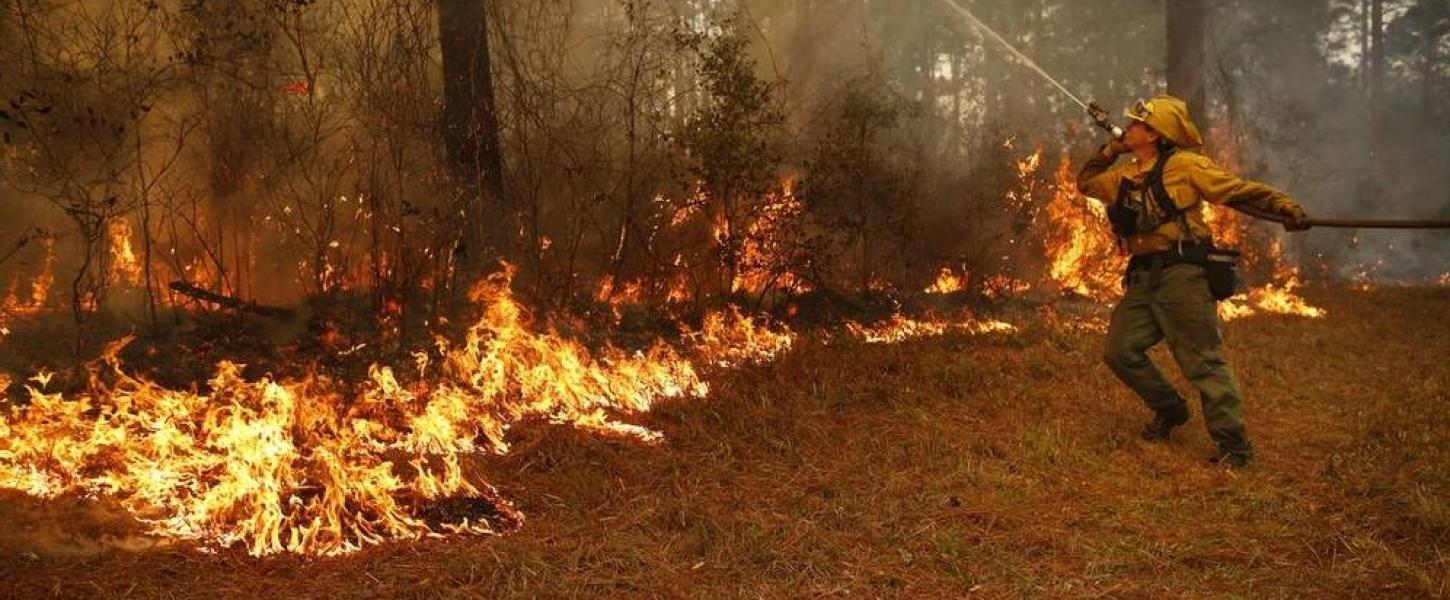 Chris Camargo works on a prescribed fire.