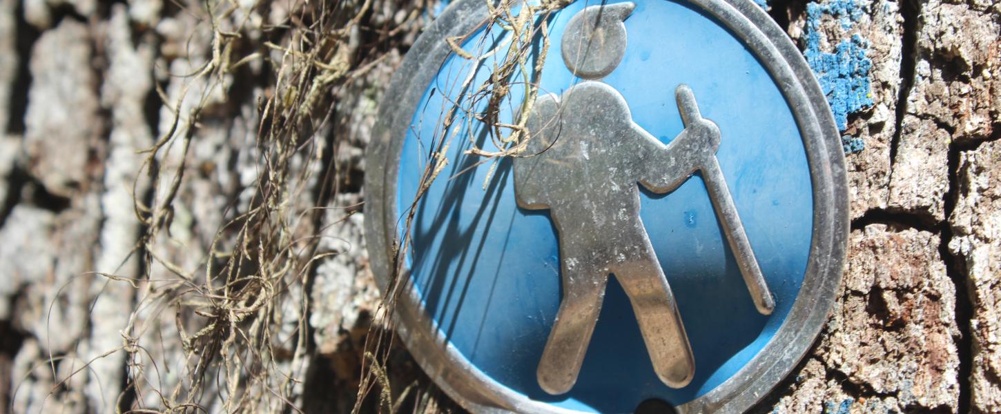 A trail marker on a hiking trail.