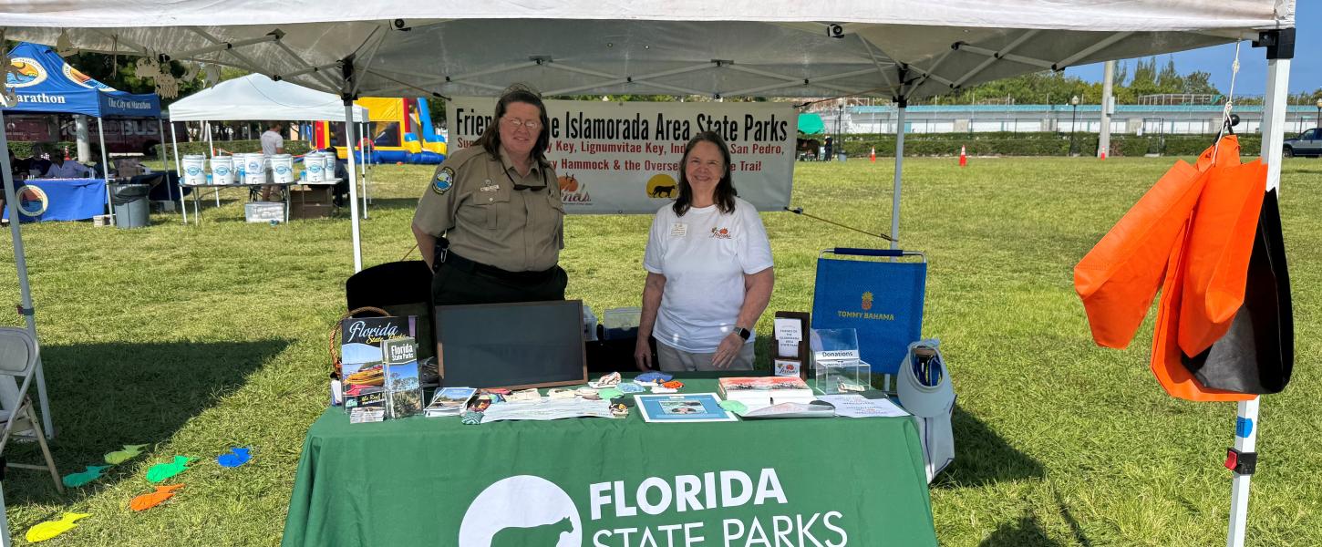 Volunteer Karen Sunderland and Ranger DeAnne Berry at a outreach booth