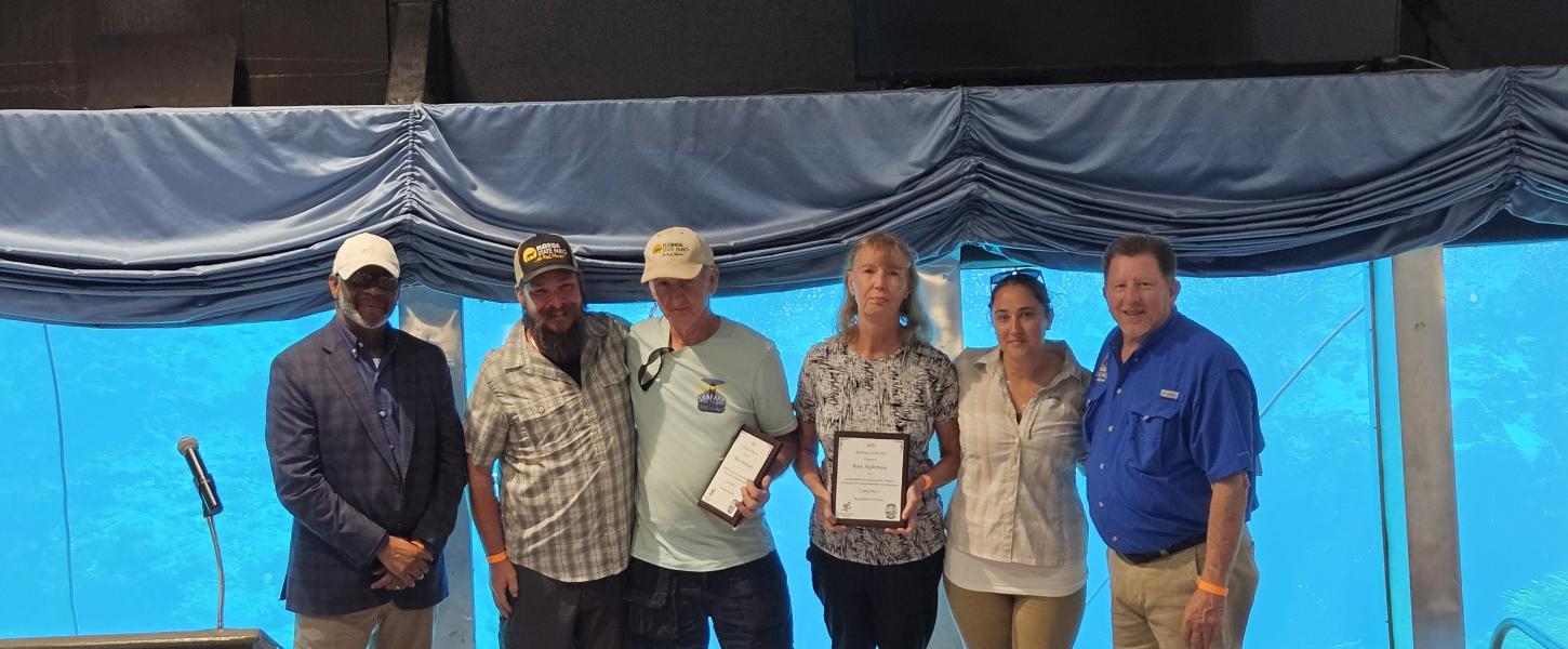 Volunteer receiving award.