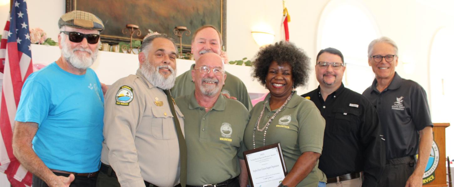 Members of the Stephen Foster CSO receive the award.