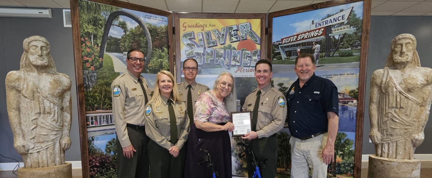 Volunteer receiving award.
