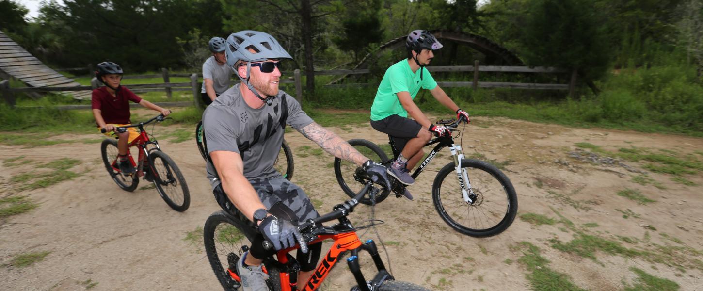 4 mountain bike riders on their bikes at the vortex