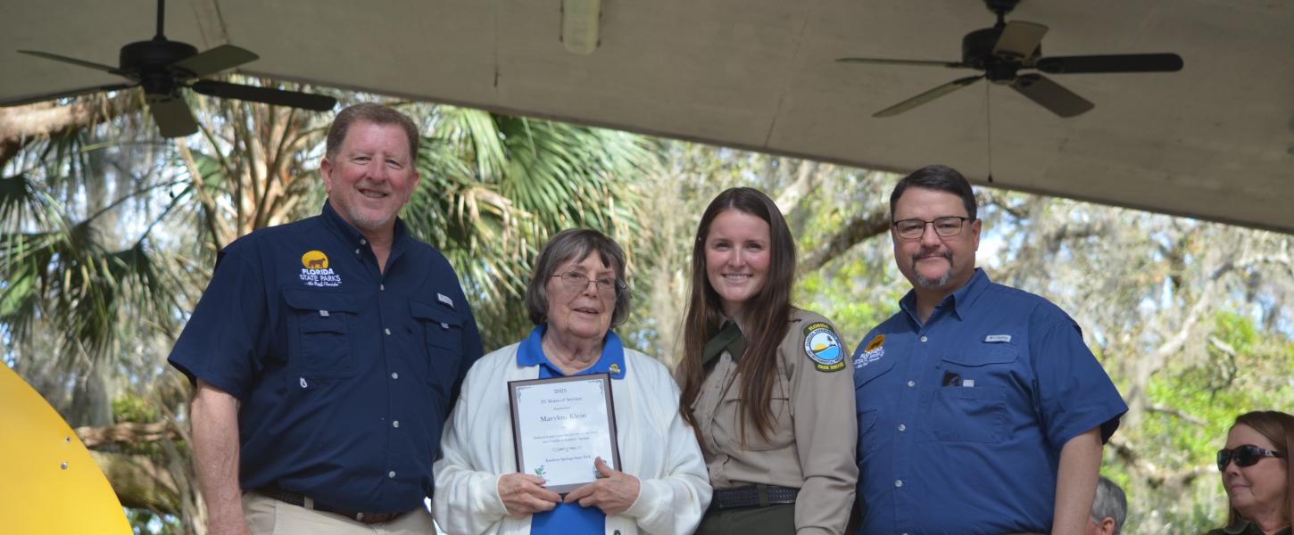Volunteer receiving award.