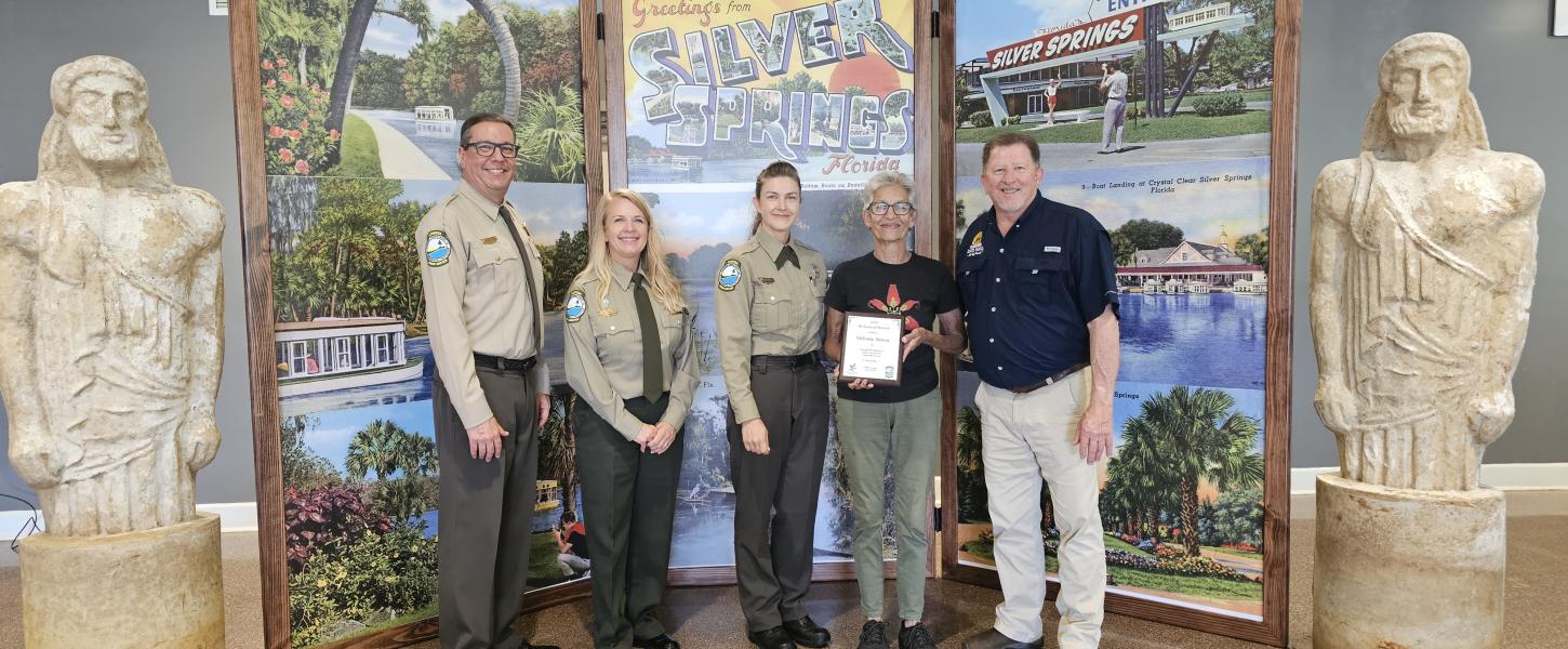 Volunteer receiving award.