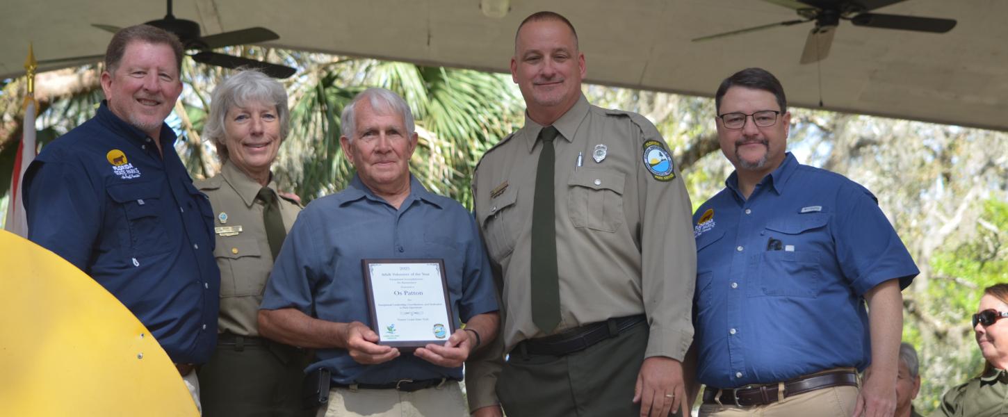 Volunteer receiving award.