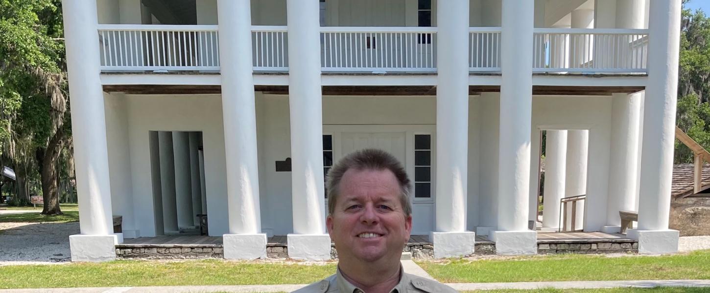 Kevin Kiser stands in front of the Gamble Mansion.