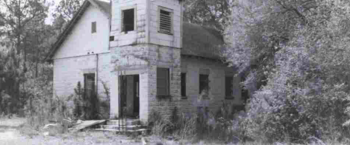 A black and white picture of a church building. 