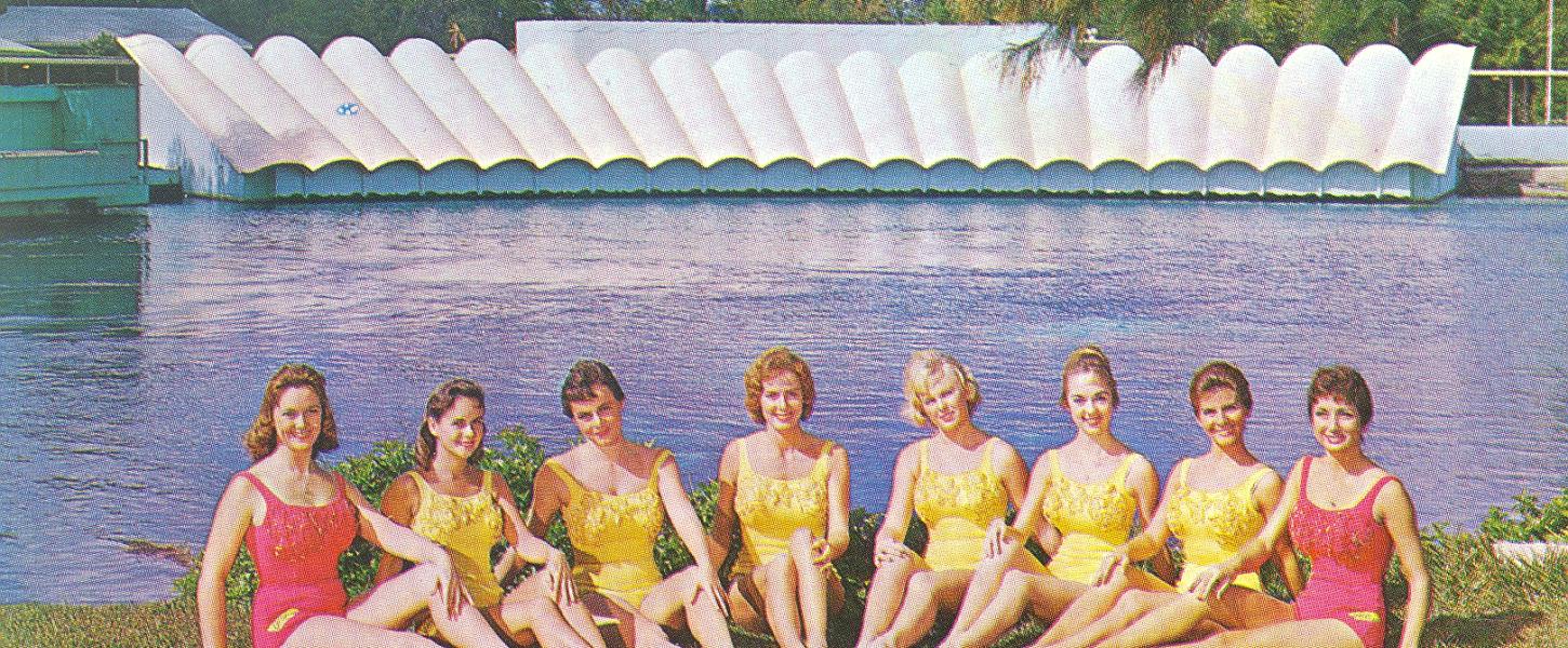 The first group of mermaids lined up in the grass in front of the theater at Weeki Wachee.