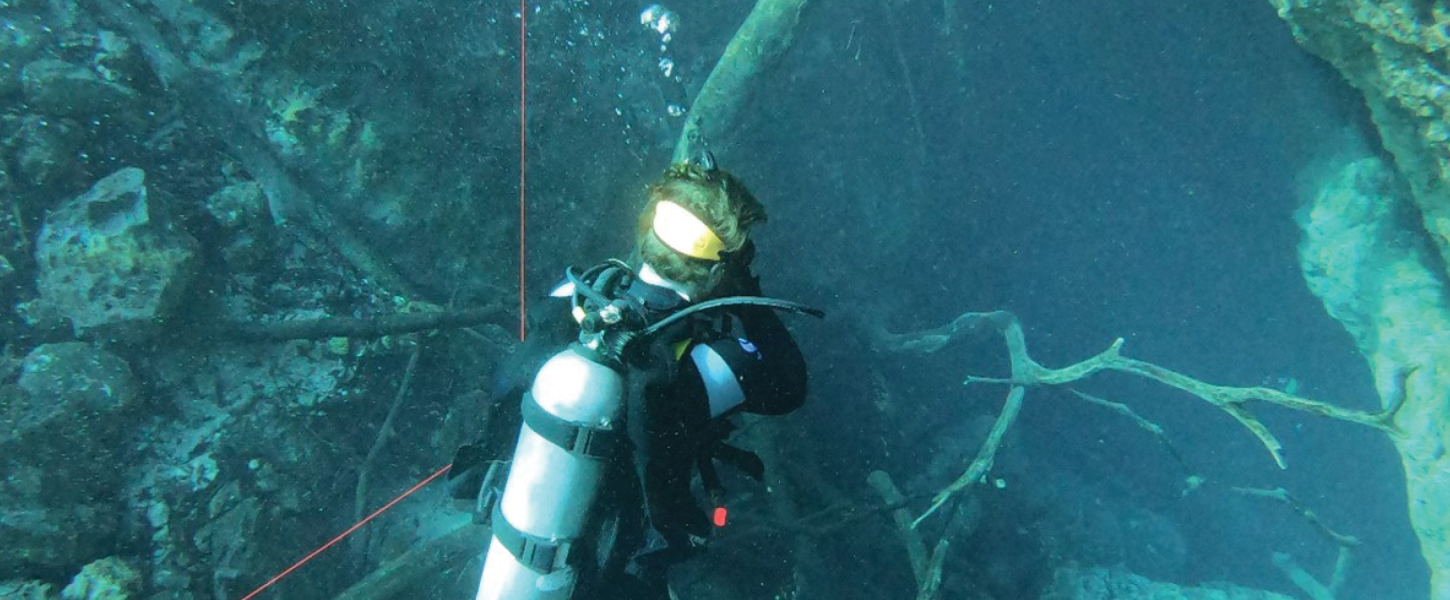 FGS geologist Dr. Ben Davis enjoying a weekend exploring Orange Grove Sink and peering into the Peacock Springs caves system.