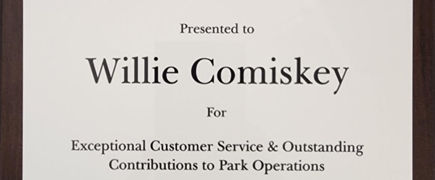 A picture of a plaque honoring Willie Comiskey