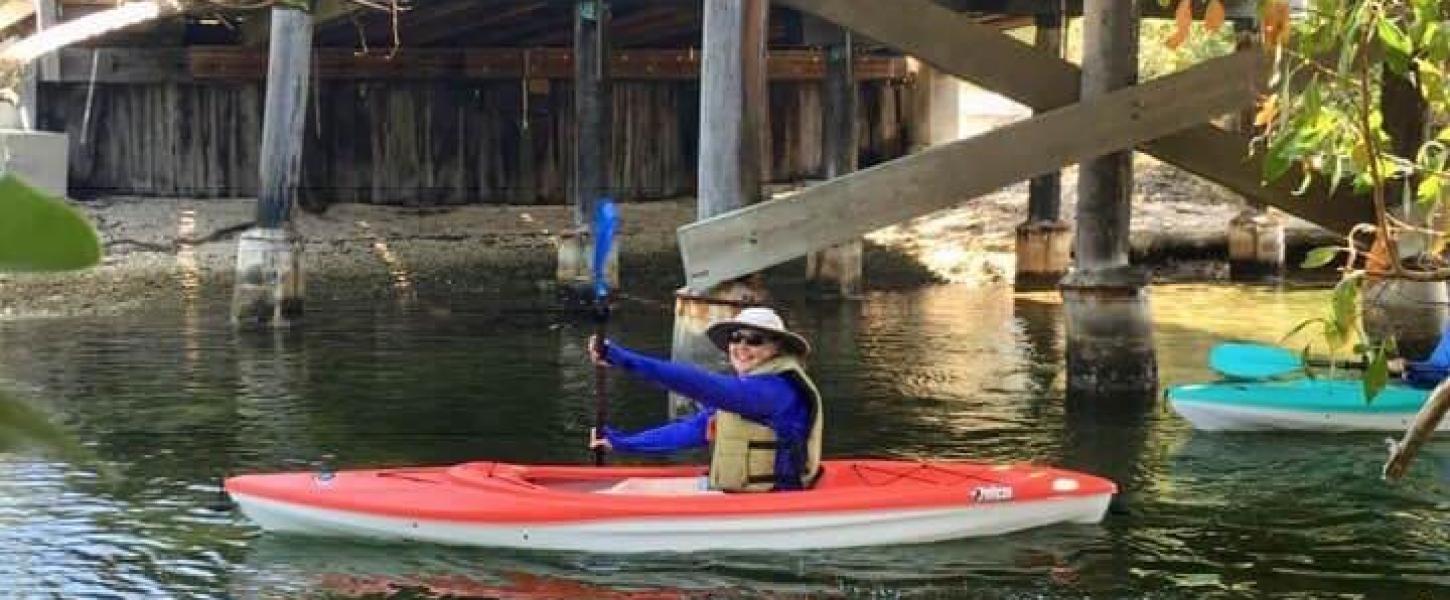 Cathy Thurow paddles under a bridge in the Florida Keys.