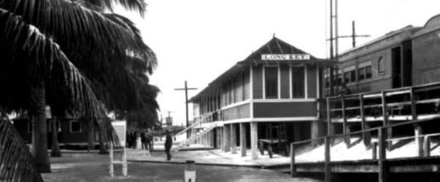 A black and white photo of the old railroad depot.