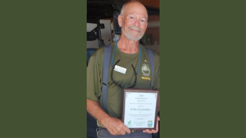 Volunteer receiving award.
