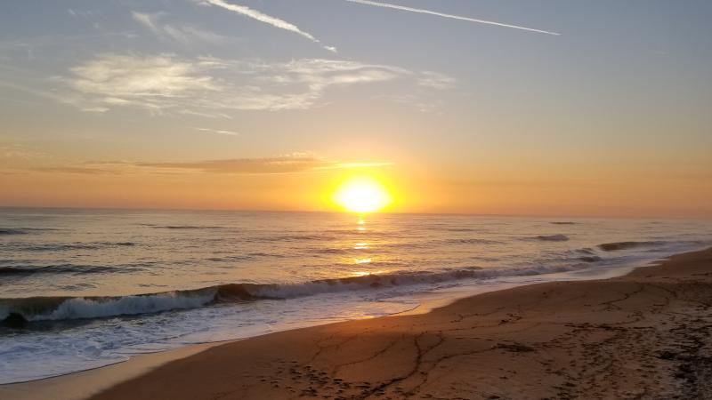 A view of the beach at sunset.