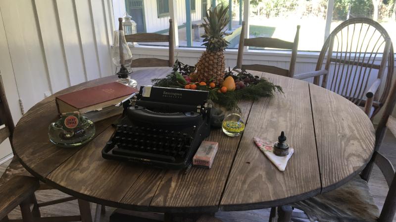 A typewriter sits on a table at the homestead.