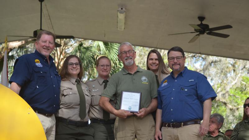 Volunteer receiving award.