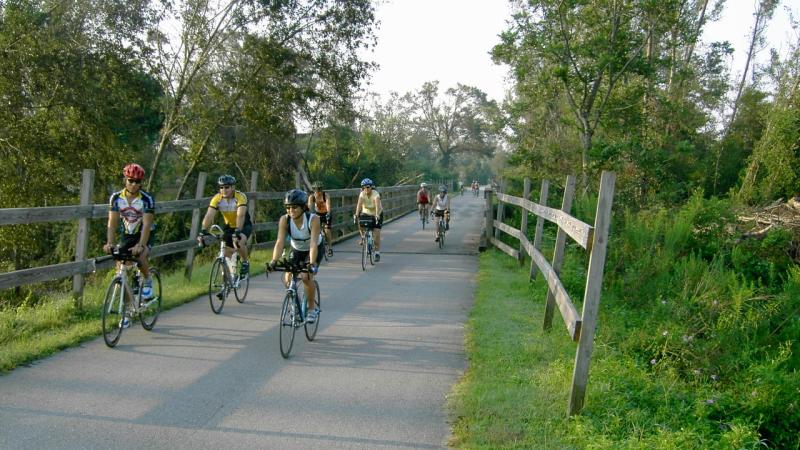 A view of a group biking down the trail