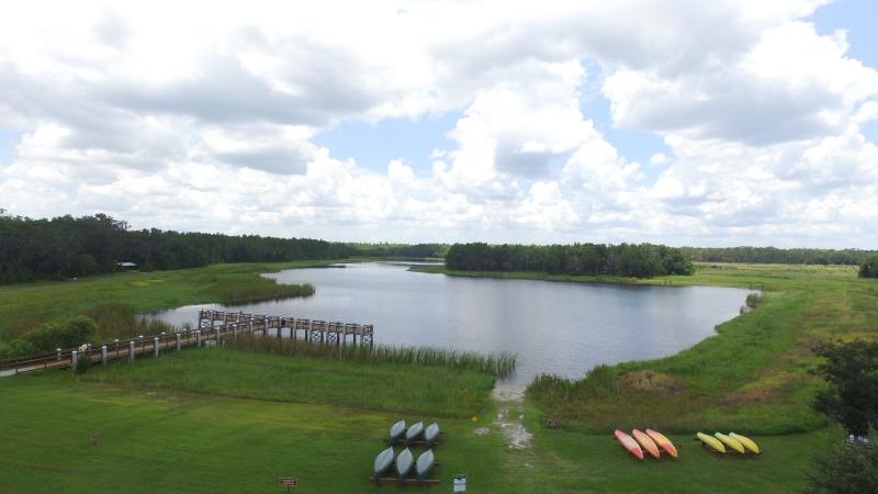 aerial photo of mac lake, the dock, and kayak/canoe rentals