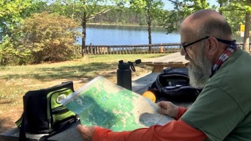 Dale Wheelis studies a map.