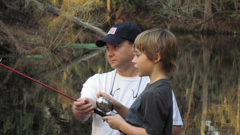A father and son fish at Hillsborough River State Park.