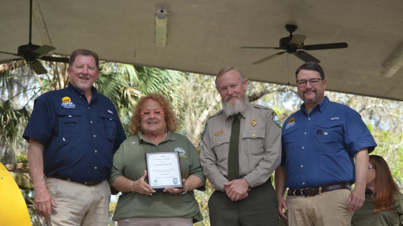 Volunteer receiving award.