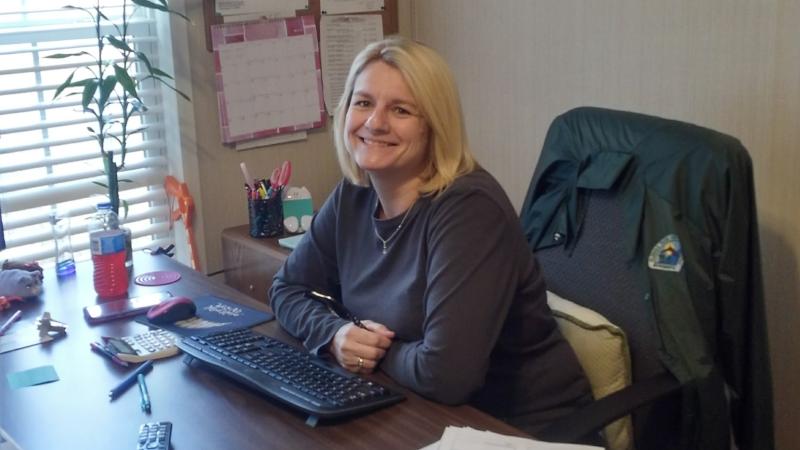 Administrative Assistant Leanne Chandler sits at her desk ready to tackle the days work. 